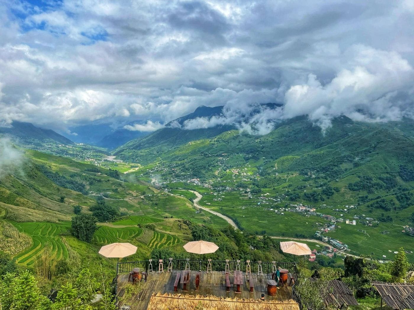 The umbrella terrace looking down on green rice terraces and the Muong Hoa valley.