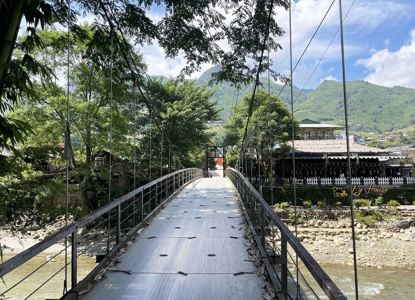 The suspension bridge over the Muong Hoa stream leading into Ta Van village.