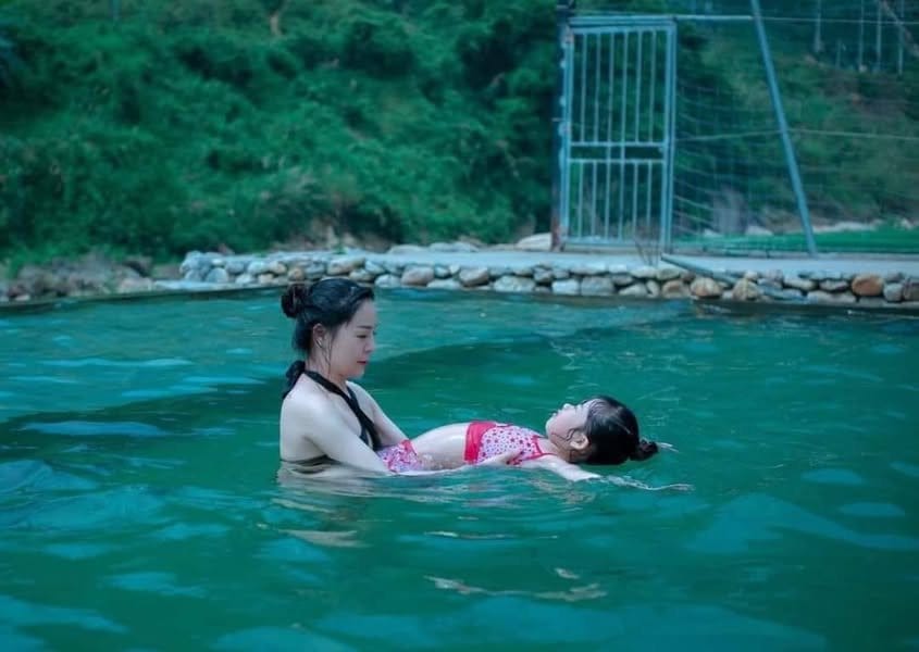 An open-air hot spring pool in the forest at Ban Ho