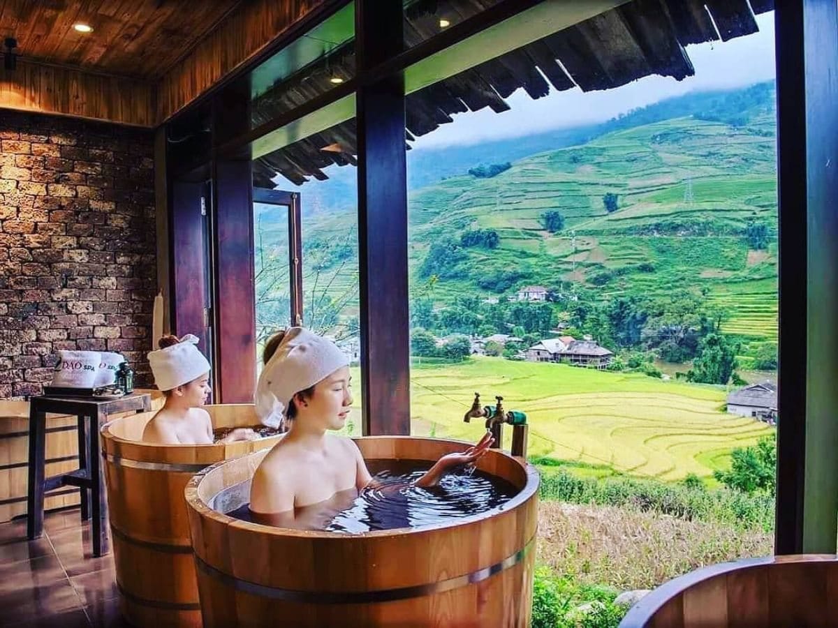 A herbal bath in a wooden tub overlooking the rice terraces