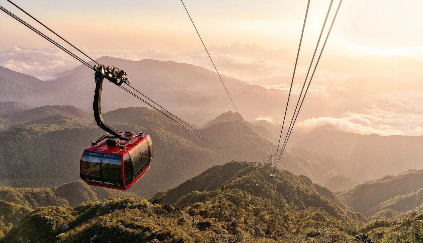 A Fansipan cable car cabin gliding over the Hoang Lien Son range.
