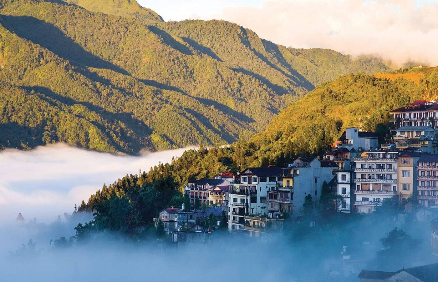 Sa Pa town seen from above, with cloud filling the valley below.