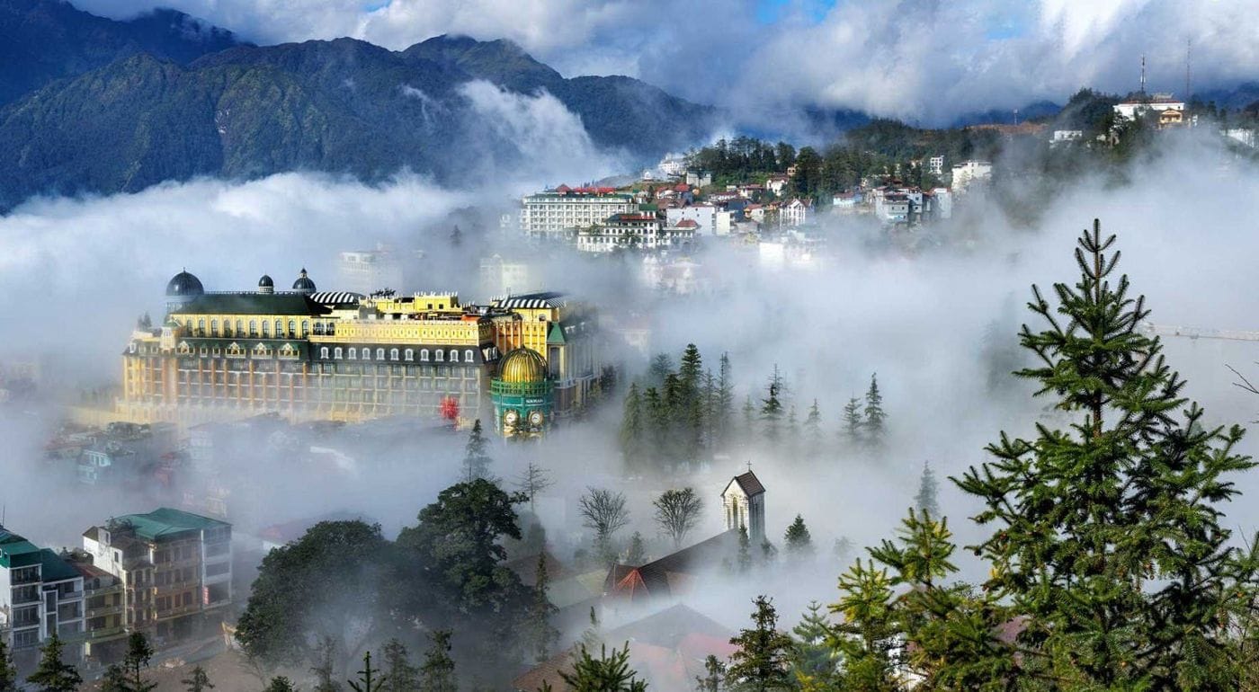 Sun Plaza and the Stone Church half hidden in cloud, seen from above.
