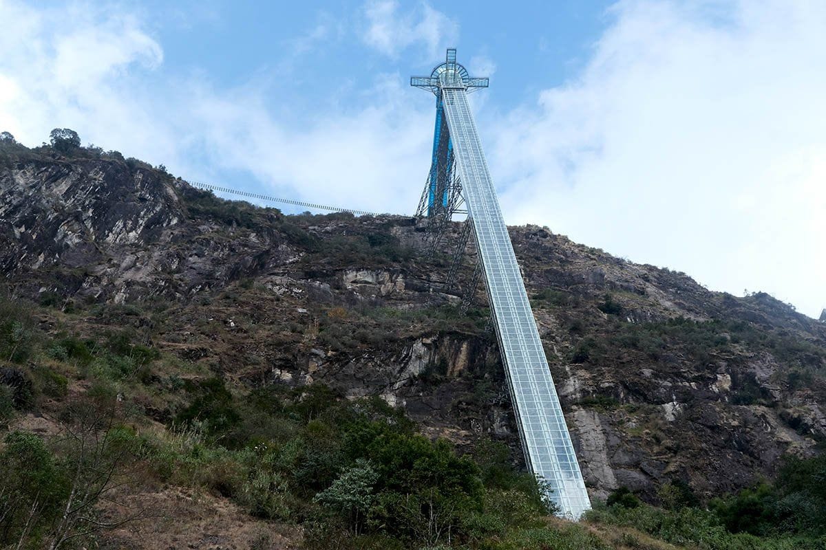 The glass-encased lift shaft running up the cliff face to the glass bridge.