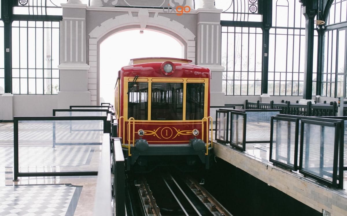 The train at the platform, with railed walkways for boarding